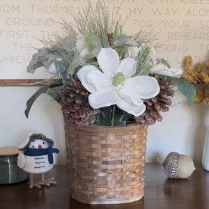 Winter hanging basket floral decor pinecones white flowers pine needles wreath